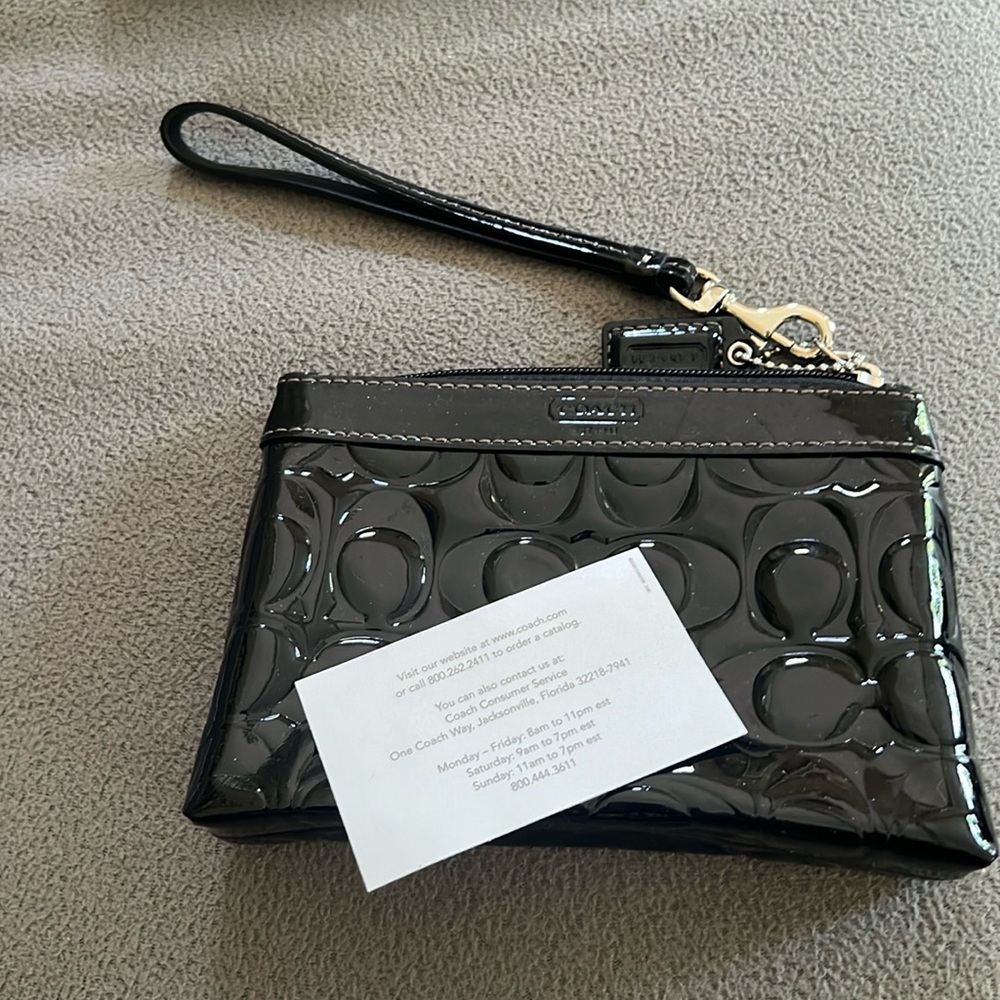 Shiny black Coach Wristlet